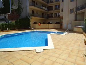 a swimming pool in the middle of a building at Apartamento Tossasea in Tossa de Mar