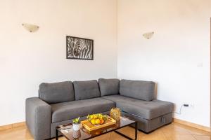 a living room with a couch and a table at Apartments Seaview in Tučepi