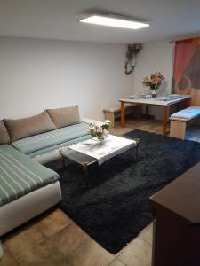 a living room with a couch and a coffee table at Bel apartment à Farra di Soligo in Soligo