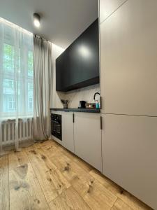 Η κουζίνα ή μικρή κουζίνα στο Heart of City Apartments V VI