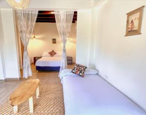 En eller flere senge i et værelse på Apartamento PAZ I Rustica House