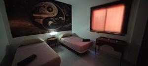 a living room with a couch and a window at Casa Quico in Santa Cruz de Tenerife