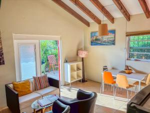 a living room with a couch and chairs and a table at Advantage Apartments Curacao in Willemstad