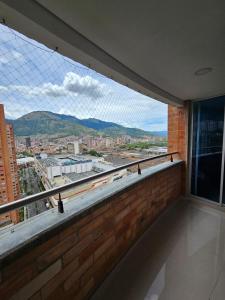 a balcony with a view of a city at Magical stay in the pink area of Bello in Bello
