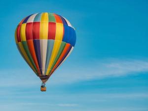 a colorful hot air balloon flying in the sky at Duchamp Healdsburg in Healdsburg