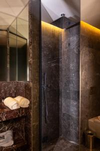 a shower with a glass door in a bathroom at Villa Sahrai, a Member of Design Hotels in Casablanca
