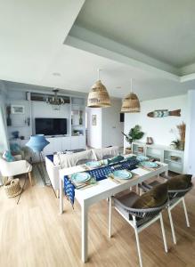 a living room with a white table and chairs at Astria Homes- your beach front home in Hulhumale +31 photos