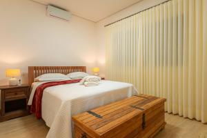 Postel nebo postele na pokoji v ubytování Magia da Serra Casa Temporada