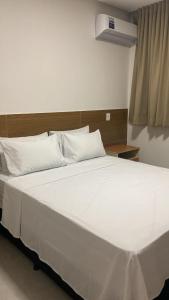 Ένα ή περισσότερα κρεβάτια σε δωμάτιο στο JBR Park Hotel