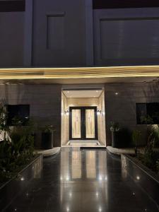 a lobby of a building with a front door at Luxurious suite with a terrace overlooking KAFD in Riyadh
