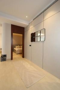 a living room with a bed in the background at Luxurious suite with a terrace overlooking KAFD in Riyadh