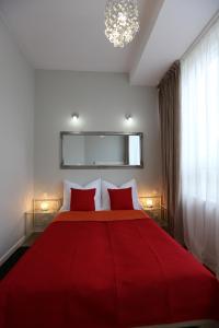 Łóżko lub łóżka w pokoju w obiekcie Apartamenty Centrum Krawiecka