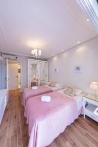 Ένα ή περισσότερα κρεβάτια σε δωμάτιο στο Apartamento de luxo e estilo no centro de Gramado