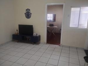 TV a/nebo společenská místnost v ubytování Quarto