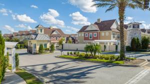 a row of houses in a residential neighborhood with palm trees at Magic Villa Orlando in Orlando