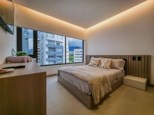 Postel nebo postele na pokoji v ubytování Studio en la mejor zona de Quito La Carolina + 38 fotografií