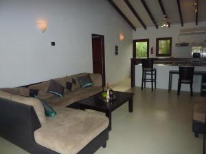a living room with a couch and a table at AquaVilla Bonaire in Kralendijk