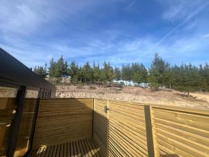 a wooden fence with a view of a beach at Matanzas Village Onshore in El Culenar