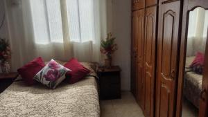 a bedroom with two beds and a large window at Apartamento in Belém