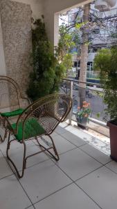 a bench on a balcony with a view of a building at Apartamento in Belém