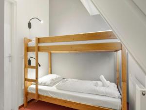 a bunk bed in a room with a staircase at Holiday Home in De Bloemert in Midlaren