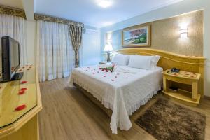 TV a/nebo společenská místnost v ubytování Hotel Thomasi Express - Londrina