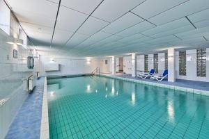a large swimming pool in a building at Knechtsand - 441 in Cuxhaven