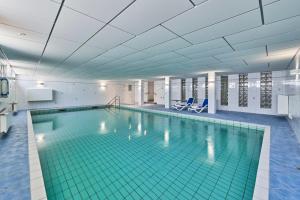 a large swimming pool in a building at Knechtsand - 403 in Cuxhaven