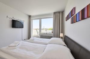 Postel nebo postele na pokoji v ubytování Rotesand - 128 + 33 fotografií