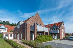 a brick house with a pitched roof at Residenz Seegras - 5 in Cuxhaven