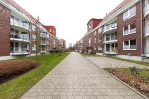 an empty street in an apartment complex with buildings at Hohe Lith - 335 in Cuxhaven