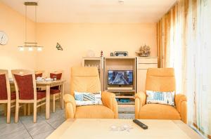 TV a/nebo společenská místnost v ubytování Seedüne - 5