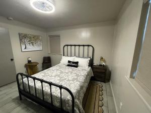 a bedroom with a bed with a pillow on it at HomeSuite Cabin Relaxing Getaway Near Casino in Hugo