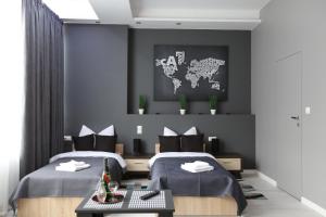 Łóżko lub łóżka w pokoju w obiekcie Apartamenty Centrum Krawiecka