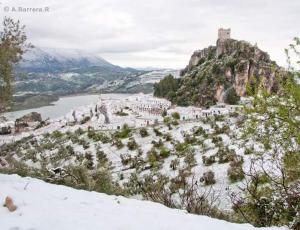 a castle on top of a mountain in the snow at Las 4 Lunas in Zahara de la Sierra