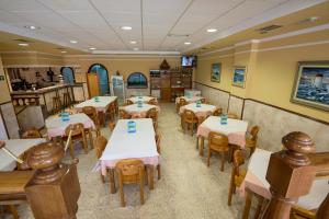 Posedenie v ubytovaní Hostal O Camouco