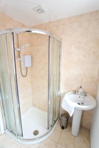 a bathroom with a shower and a sink at Ripley Peak District Gateway in Ripley +14 photos
