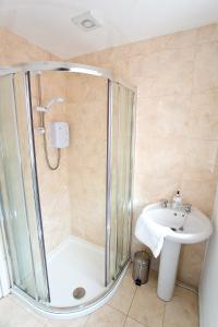 a bathroom with a shower and a sink at Ripley Peak District Gateway in Ripley