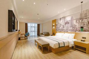Ένα ή περισσότερα κρεβάτια σε δωμάτιο στο City Comfort Inn Dongguan Dalingshan Xinli Agricultural Wholesale +228 φωτογραφίες