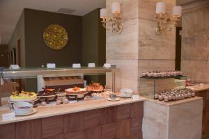 a buffet line with many different types of food at Maritim Antonine Hotel & Spa in Mellieħa