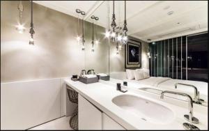 a bathroom with a sink and a mirror at Hotel Forestar in Seoul +27 photos