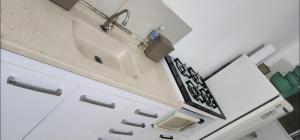 a bathroom with a sink and a counter top at Granja Vianna Charming in Cotia +30 photos