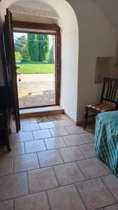 a room with a door and a tiled floor at Tenuta Antico Leccio in Gioia del Colle