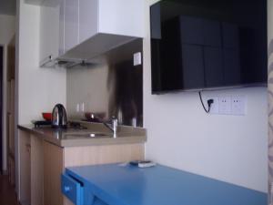 Köök või kööginurk majutusasutuses Qingdao Mi Apartment