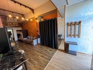a living room with a black curtain in a room at Стадия лофт 2 in Chornomorsk