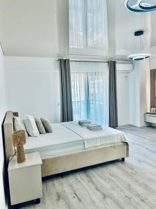 Postel nebo postele na pokoji v ubytování Luxury Towers Loft + 23 fotografií