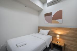 Ένα ή περισσότερα κρεβάτια σε δωμάτιο στο Cove Merakey