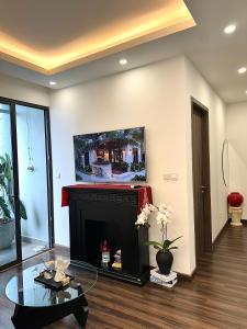 Televisyen dan/atau pusat hiburan di Anmie Home - Hoàng Huy CMC