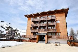 a building with balconies on the side of it at Résidence Le Mustag - 2 Pièces 4 pers. - LE MUSTAG - 021MU - PLAGNE CENTRE MAE-0273 in Aime La Plagne +3 photos