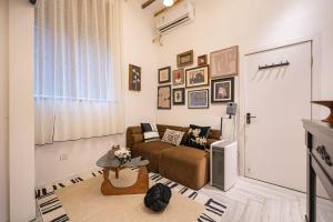 a living room with a couch and a table at Shanghai Hills&Well-time MCM Family loft Near Line2 and line13 West Nanjing Road in Shanghai